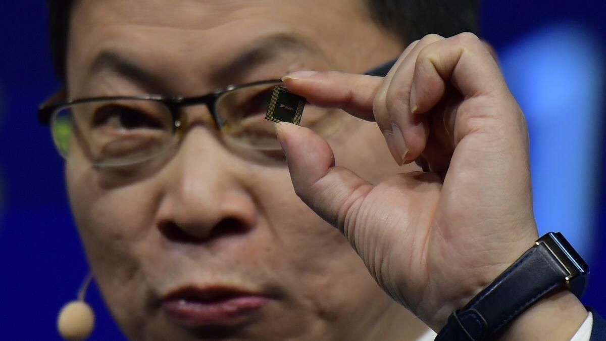 Richard Yu with the Kirin 990, among the long line-up of Huawei's acclaimed hardware.