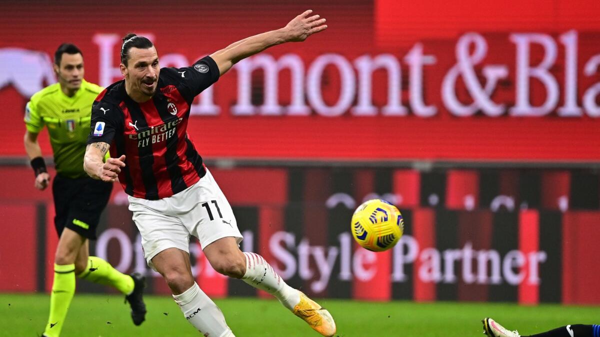 AC Milan's Zlatan Ibrahimovic shoots on goal during the Italian Serie A match against Atalanta. — AFP