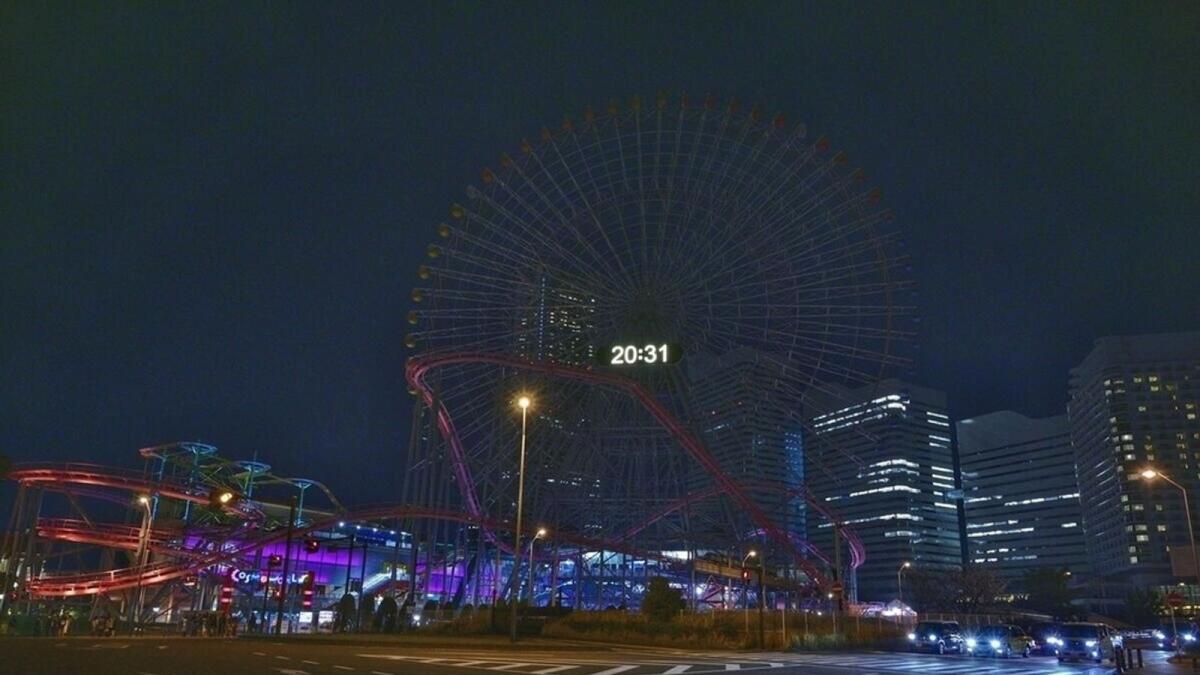 A ferris wheel is seen after its lights were switched off during the Earth Hour 2021 celebrations, in Japan.