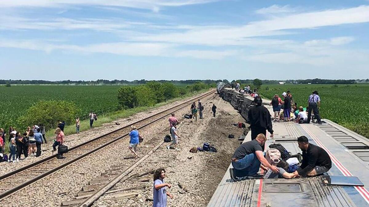 An Amtrak passenger train lies on its side after derailing near Mendon, Mo., on Monday, June 27, 2022. Photo: AP