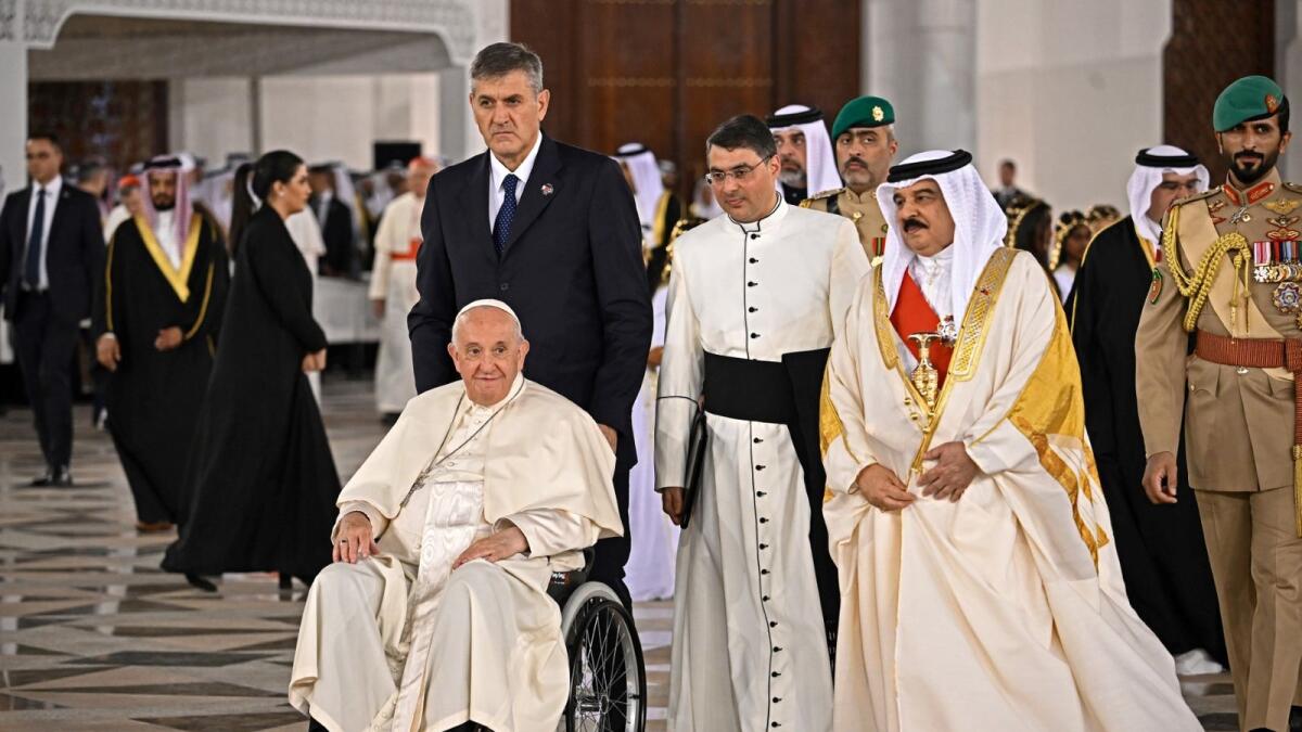 Pope Francis  is escorted by Bahrain's King Hamad bin Isa Al Khalifa (C-R) as he leaves the Royal Palace in the capital Manama on November 3. – AFP