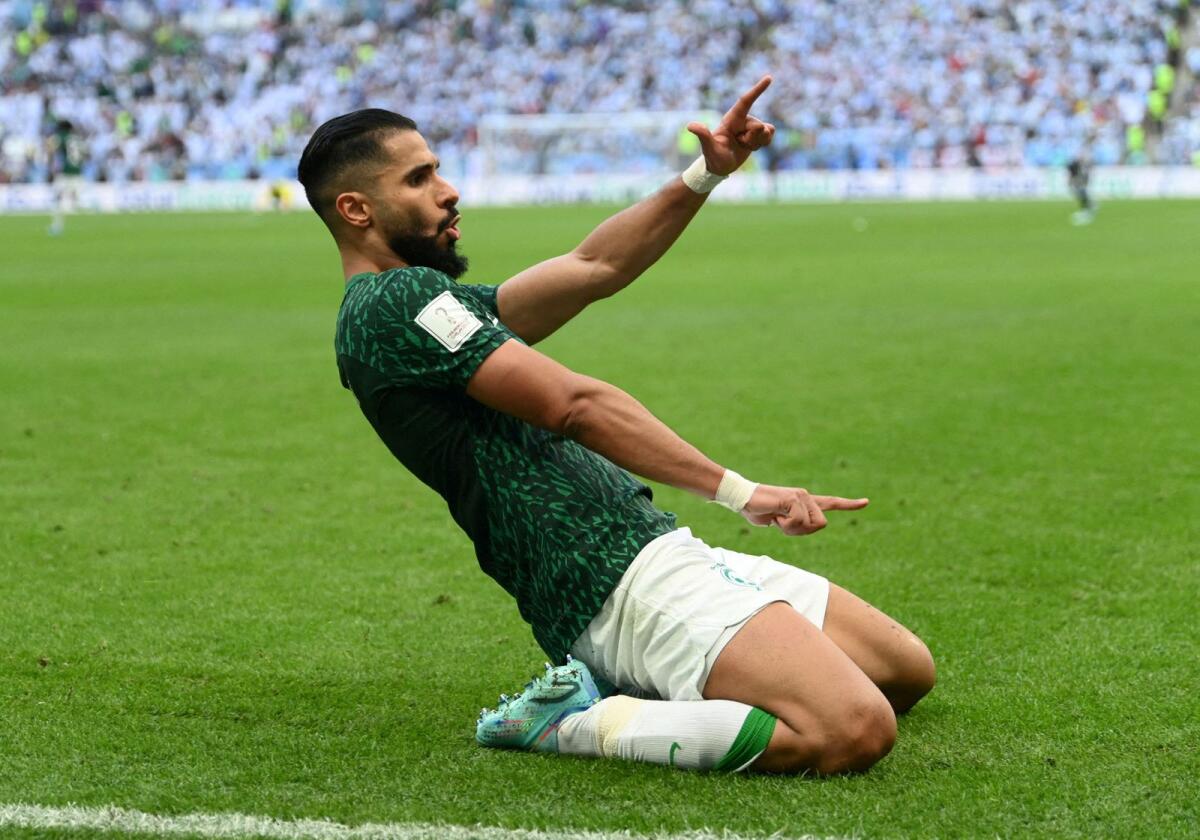 Saudi Arabia's Saleh Al-Shehri celebrates after scoring a goal against Argentina in the 2022 World Cup. Saudi beat Argentina 2-1 in its opening match of the tournament. — Reuters