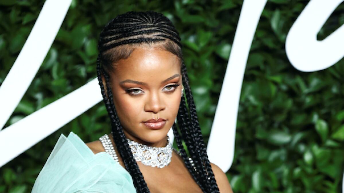 Rihanna who won the ‘urban luxe award’ stood out in a mint green satin bustier dress