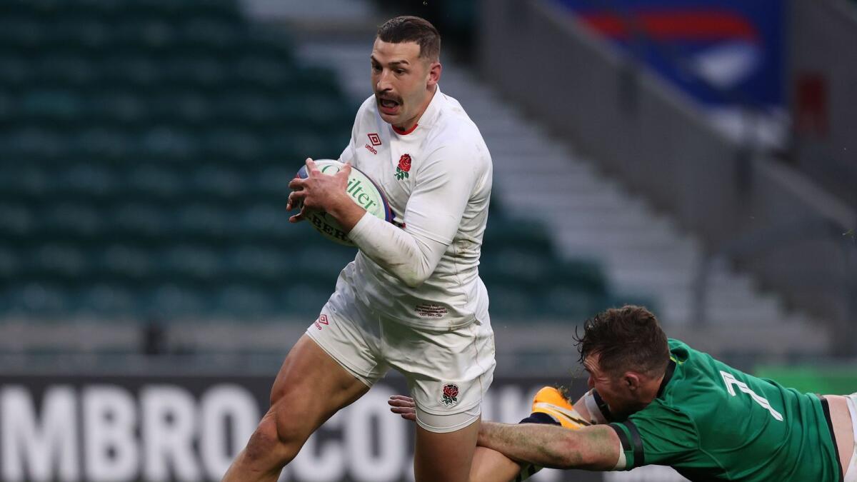 England's wing Jonny May (left) scores their second try during the Autumn Nations Cup international rugby union match between England and Ireland at Twickenham. — AFP