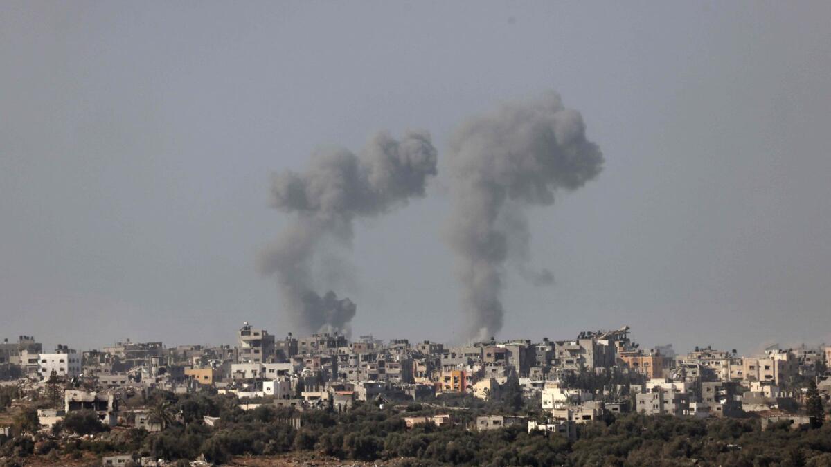 Smoke billowing over central Gaza following Israeli strikes on January 1. — AFP
