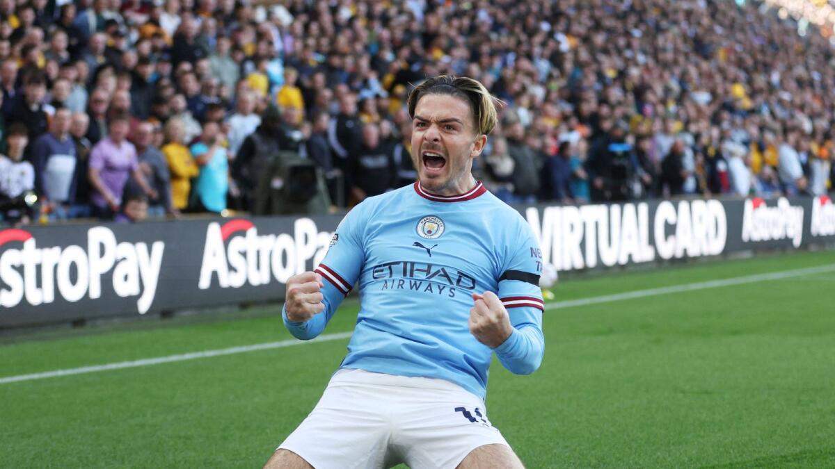 Manchester City's Jack Grealish celebrates after scoring their first goal. — Reuters