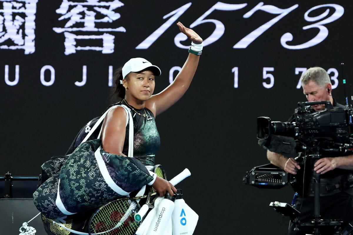 Naomi Osaka walks off the court after losing against Caroline Garcia. — AFP