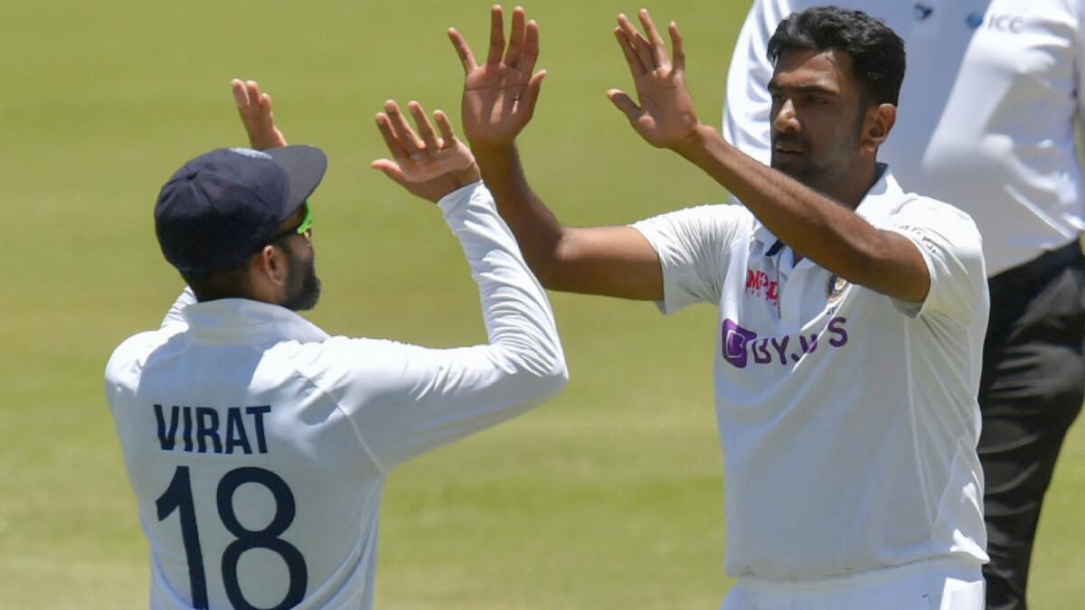 India's Virat Kohli (left) congratulates Ravichandran Ashwin after the spinner dismissed South Africa's Kagiso Rabada in the first Test. (AFP)
