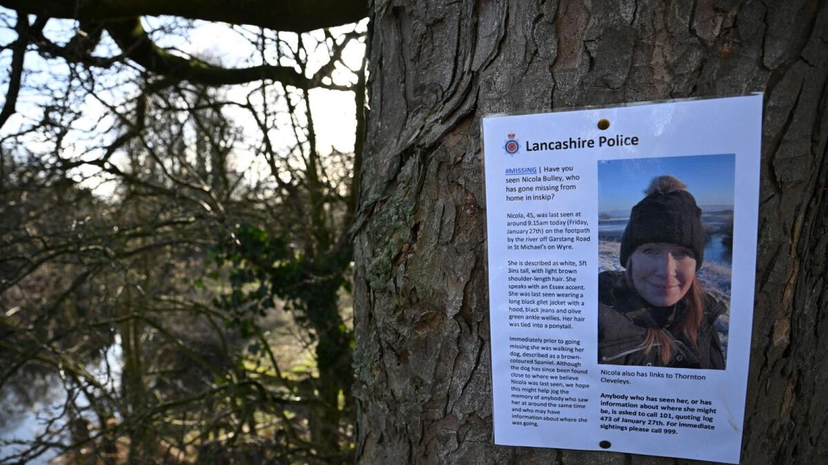 A poster asking for information on missing Nicola 'Nikki' Bulley is pictured on a tree close to where her phone and dog's harness were discovered, by the banks of the River Wyre, in St Michael's on Wyre, near Preston, north west England on February 6, 2023. — AFP
