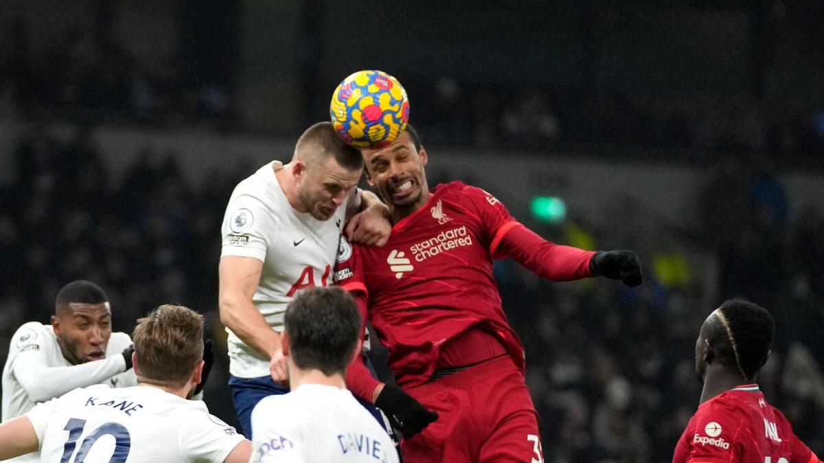 Liverpool's Joel Matip (top right) duels for the ball with Tottenham's Eric Dier. (AP)