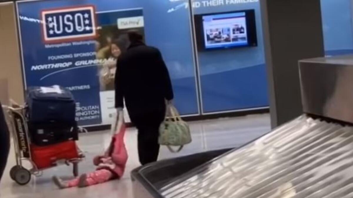 Video: Man drags daughter through airport by her hood