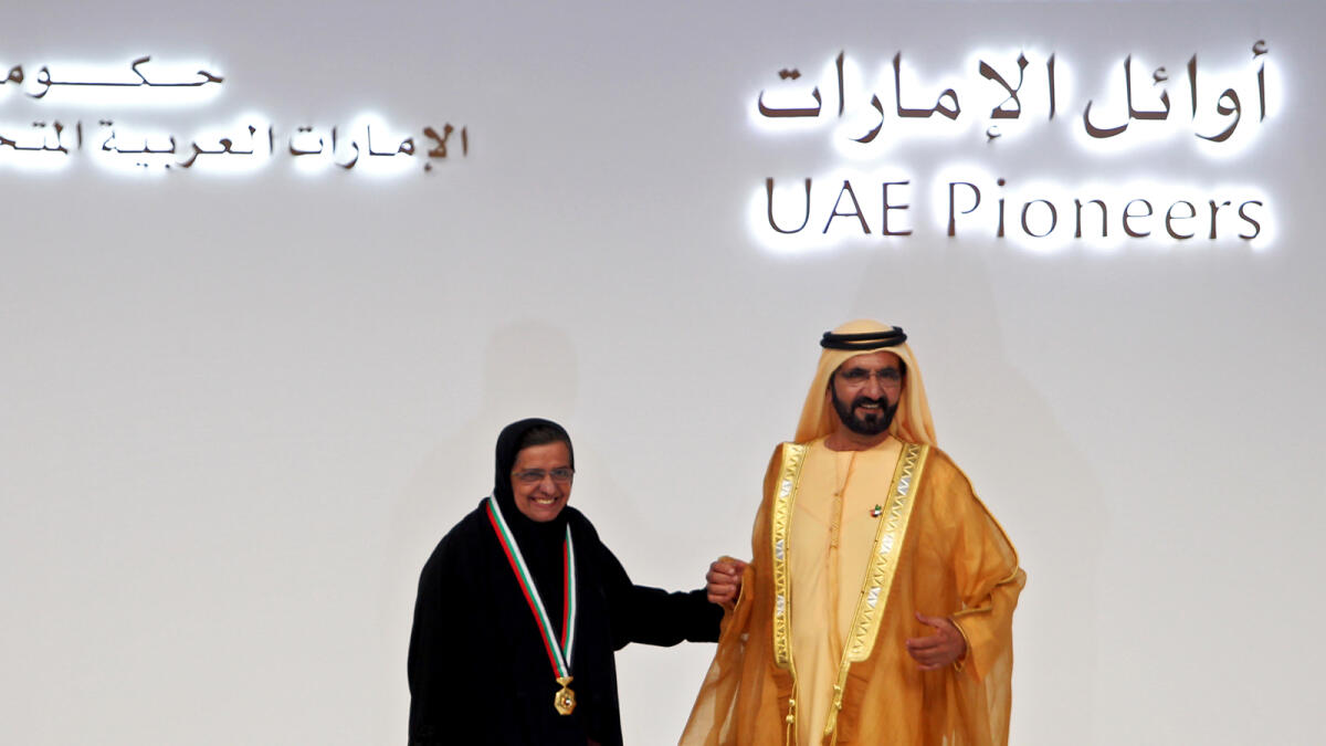 Shaikh Mohammed with Hessa Lootah at the UAE Pioneers Award ceremony.