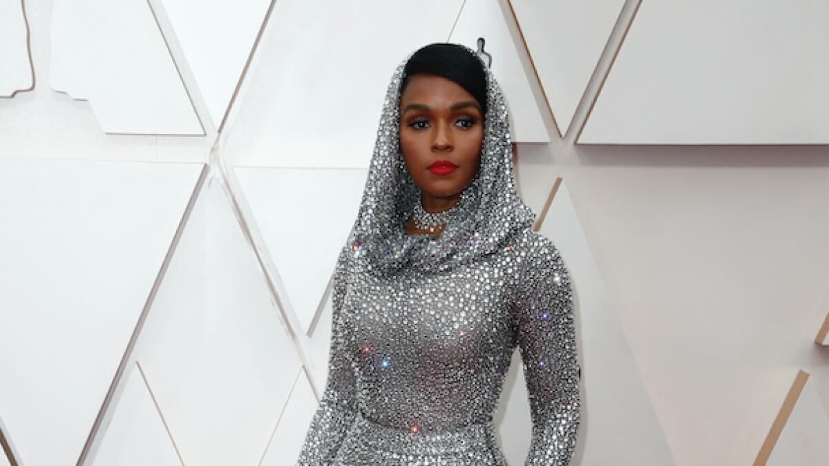 Janelle Monae stunned in silver Ralph Lauren with a hood, long sleeves and about 170,000 Swarovski crystals.