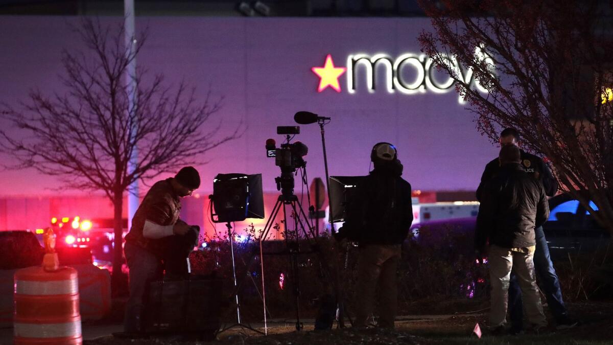 A television news crew reports from outside the Mayfair Mall after a gunman opened fire on November 20, 2020 in Wauwatosa, Wisconsin. AFP