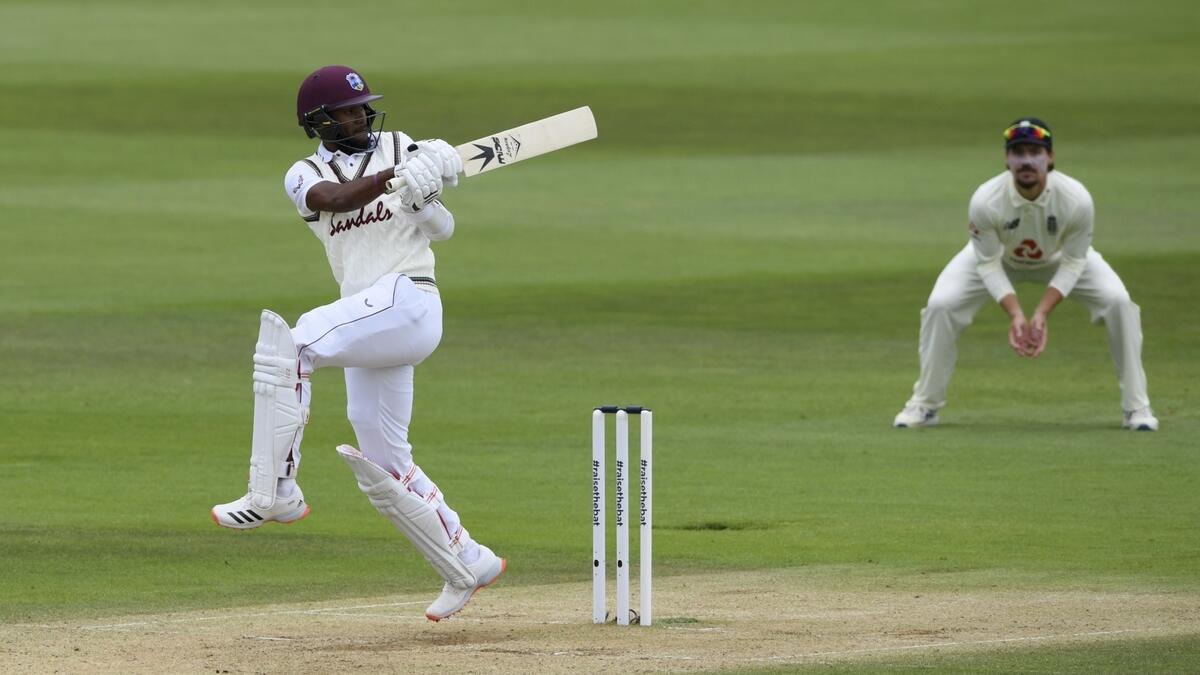 West Indies' Kraigg Brathwaite hits a boundary during the third day of the first Test