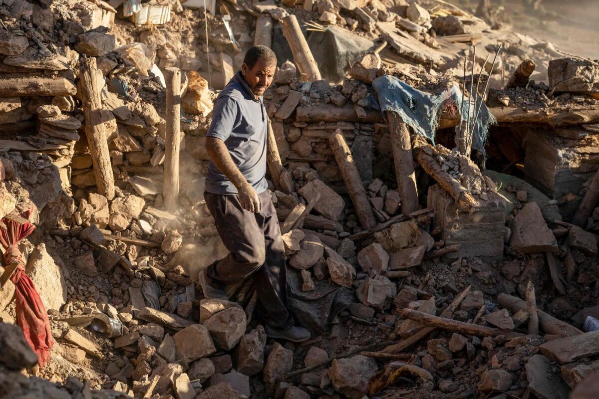 A villager searches for survivors amidst the rubble after an earthquake in the mountain village of Tafeghaghte, southwest of the city of Marrakesh, on September 9, 2023. — AFP