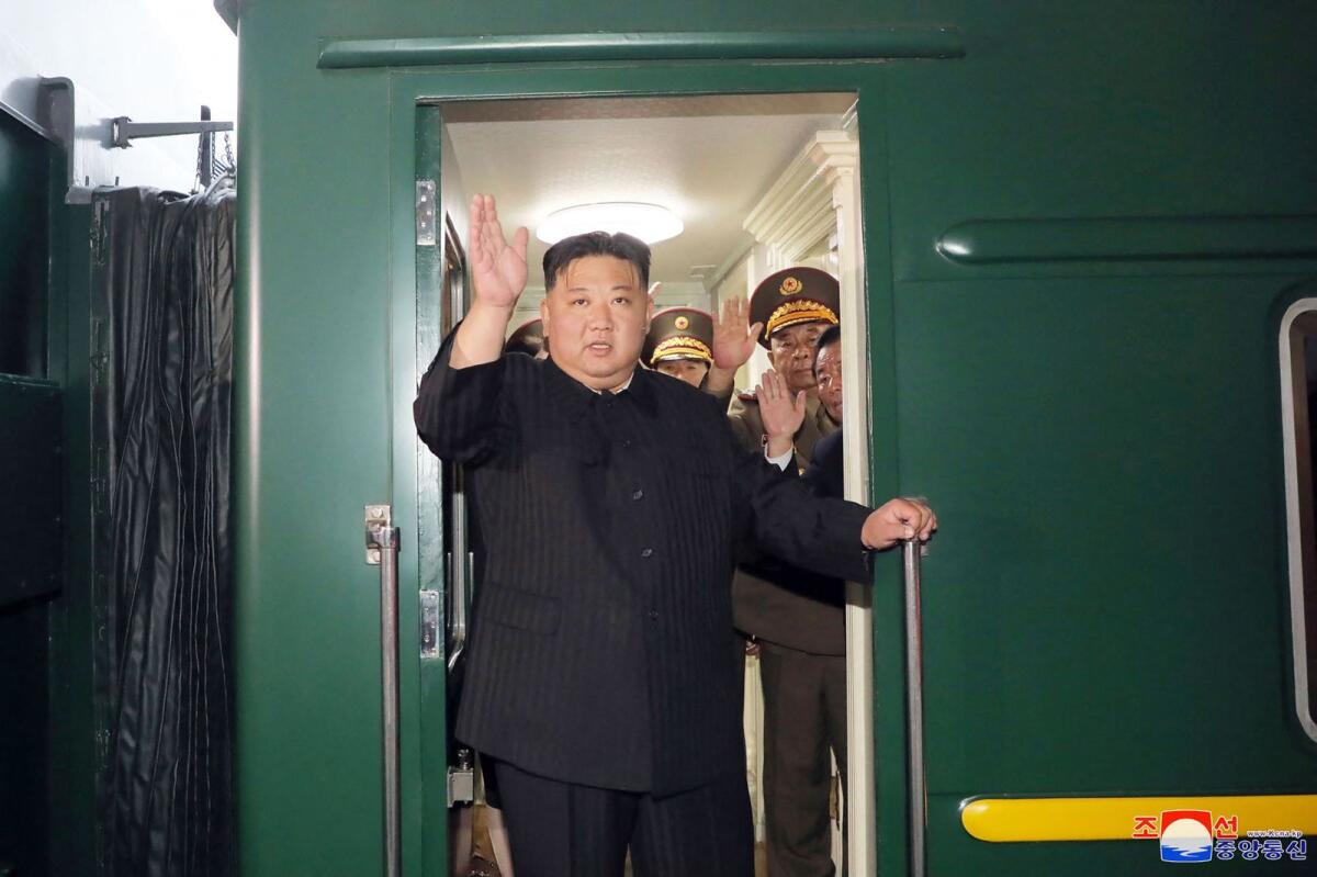 North Korea's leader Kim Jong Un (C) waving as he departs by train from Pyongyang for a visit to Russia. -- AFP