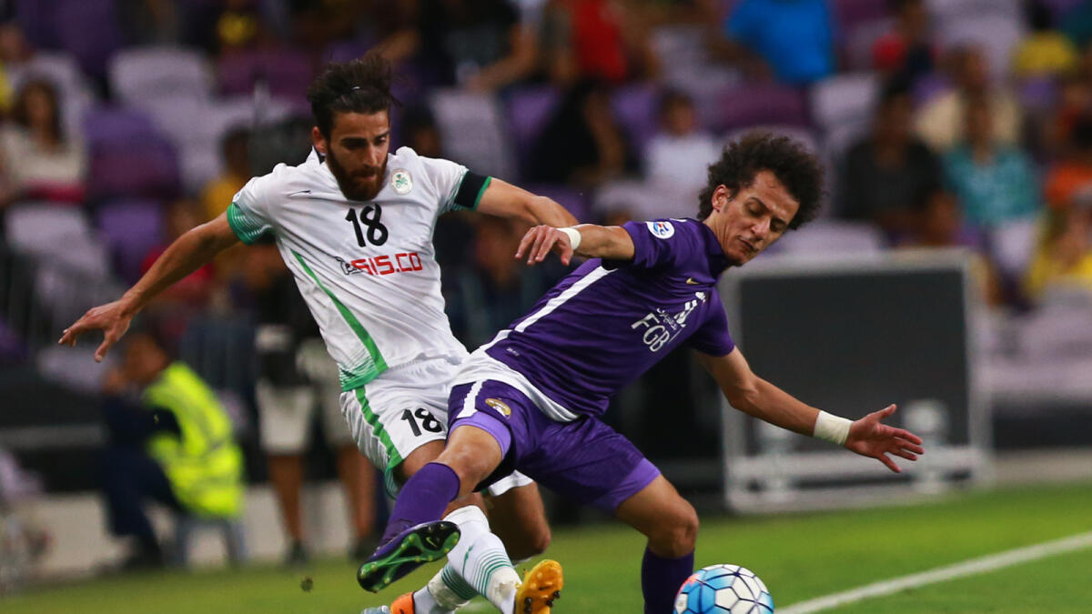 Ali Hamam of Zobahan fights for the ball with Al Ain’s Mohammed Abdulrahman on Wednesday. — Photo by Nezar Balout