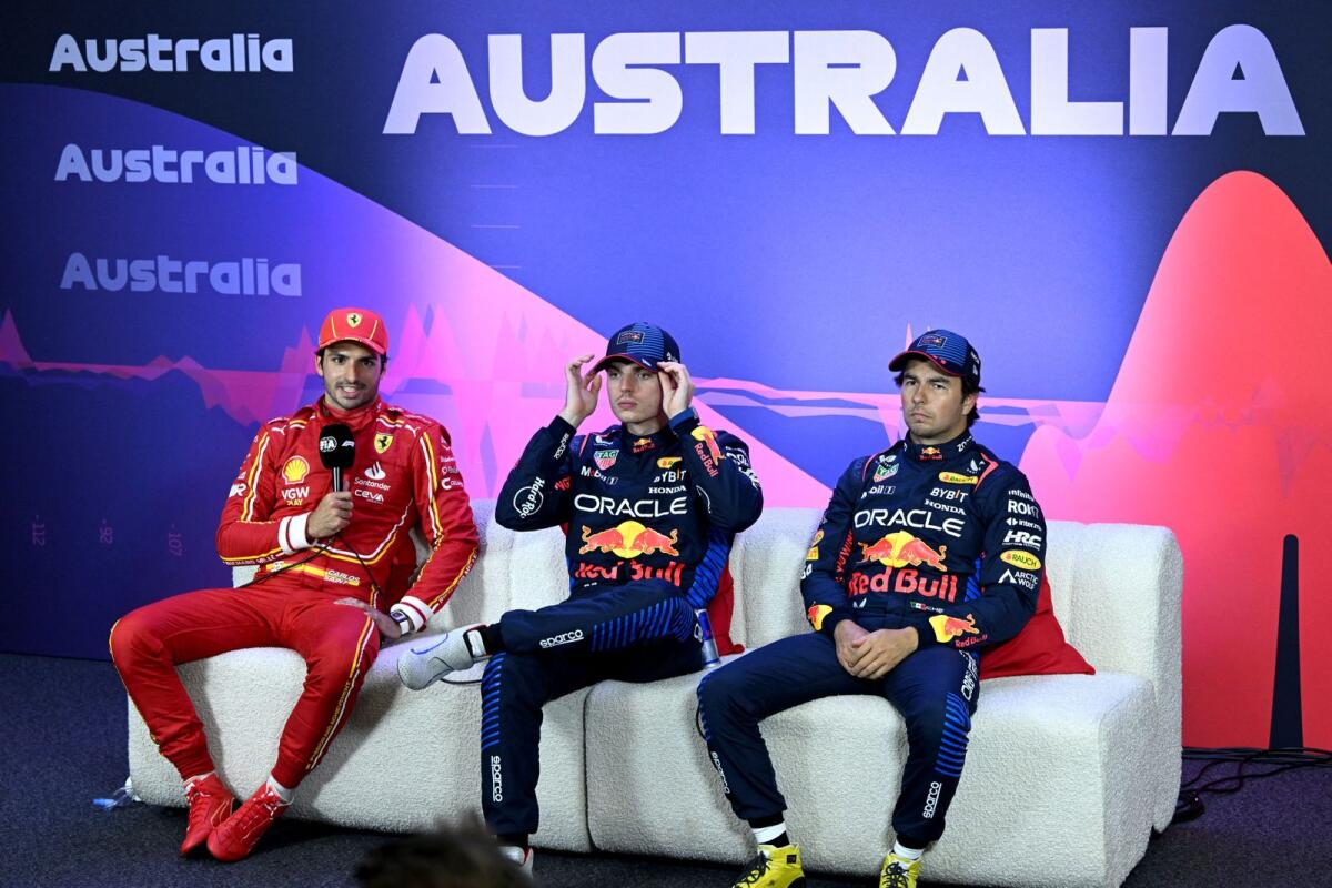 Red Bull's Max Verstappen (C) after qualifying in pole position with second placed Ferrari's Carlos Sainz Jr. (left) and third Red Bull's Sergio Perez. - Reuters