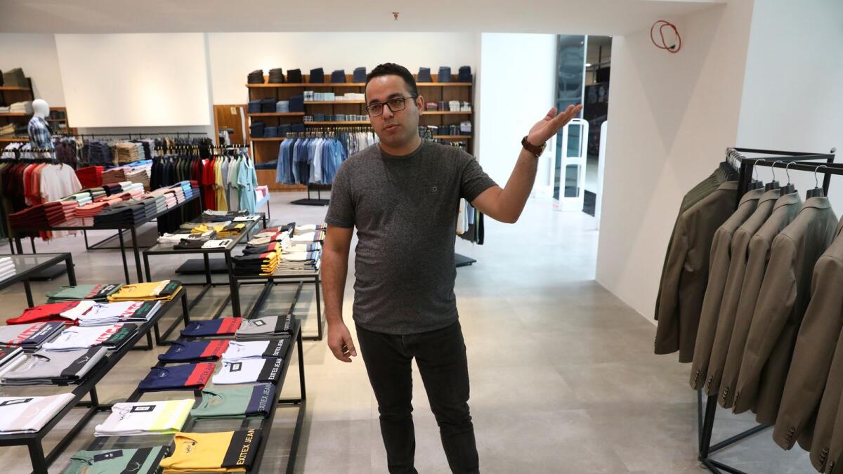 Sasan Ghafouri, a shopkeeper at a men's clothing store at Tehran Mall shopping centre, in Tehran.