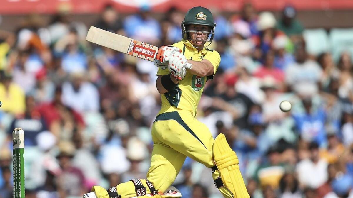 Australia's David Warner plays a shot on his way to a century during their one-day international cricket match against India in Sydney, Australia