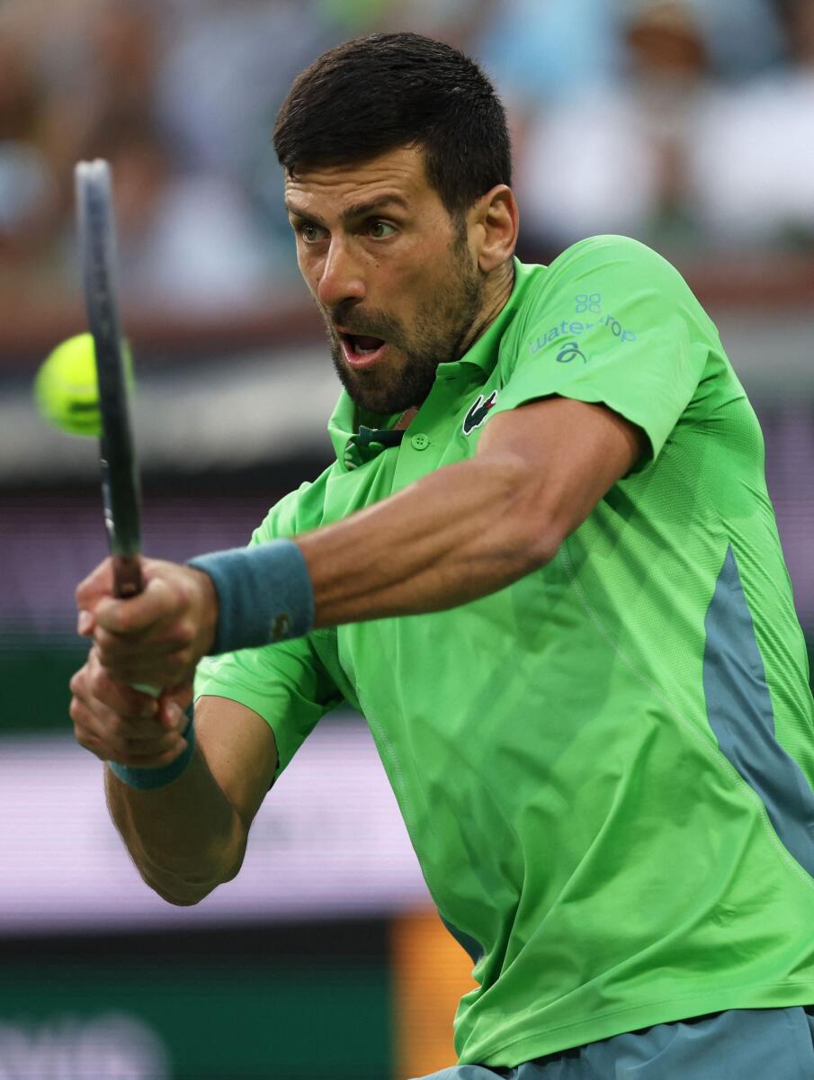 Novak Djokovic of Serbia plays a backhand against Aleksandar Vukic of Australia in their second round match during the BNP Paribas Open at Indian Wells Tennis Garden on March 09, 2024 in Indian Wells, California.  - AFP
