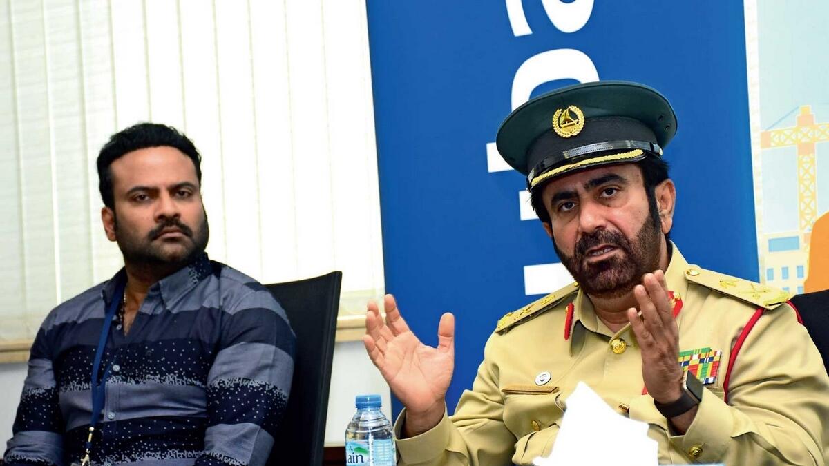 Maj-Gen Dr Al Salal Syed Al Falasi of Dubai Police and Keralite actor and mimicry artist Tini Tom at the Press conference announcing the International Day of Happiness. — Photo by Shihab