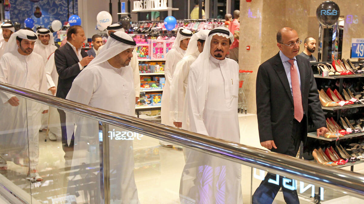 BZ150715-MS-CENTRALE- in the center H.H. Sheikh Humaid Bin Rashid Al Nuaimi -  Ruler of Ajman with Nilesh Ved chairman Apparel Group- next to ruler -  taking the round  after the inaugurated the GRAND CENTRALE Mall in Ajman on Tuesday Night – Photo by M.Sajjad