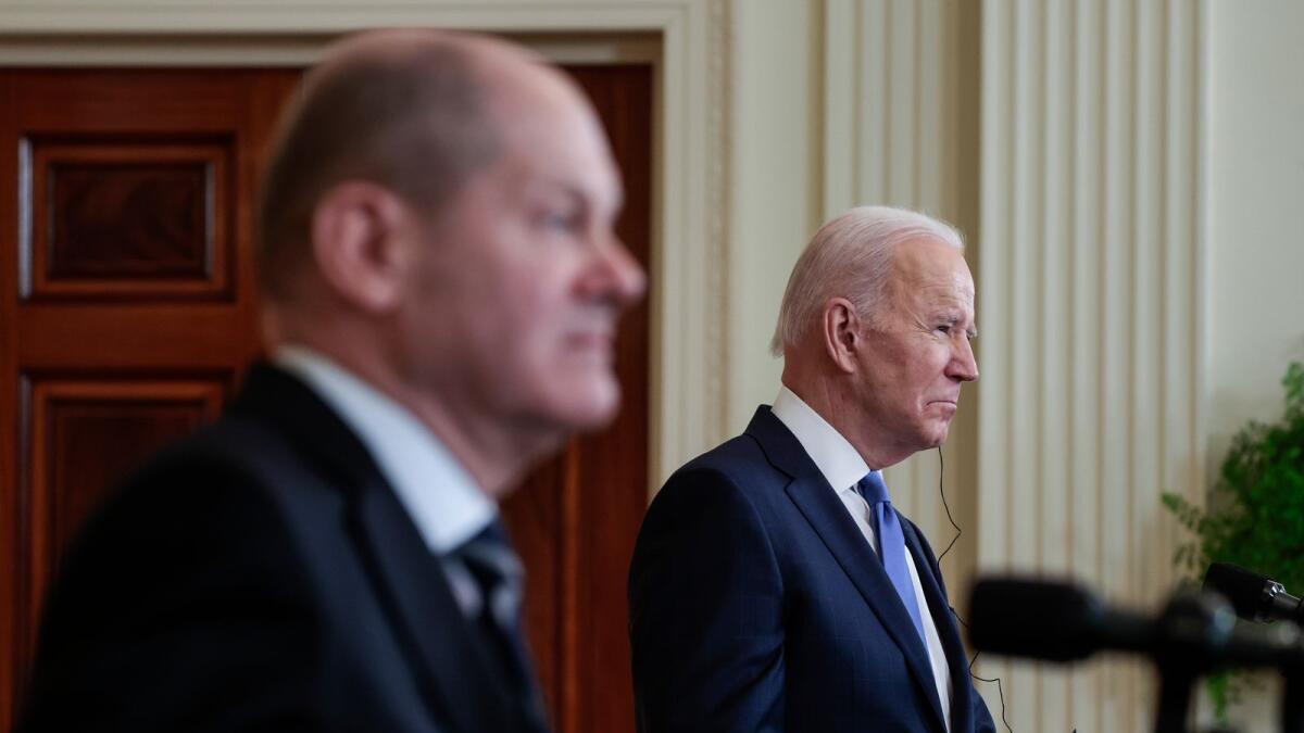 German Chancellor Olaf Scholz (L) and U.S. President Joe Biden participate in a joint news conference in the East Room of the White House on February 07, 2022 in Washington, DC. Photo: AFP