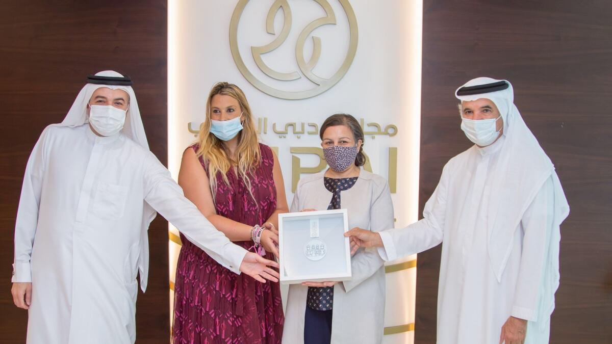 Marion Bartoli with Raja Rabia, Saeed Hareb and Nasser Aman Al Rahma at the Dubai Sports Council office. (Supplied photo)
