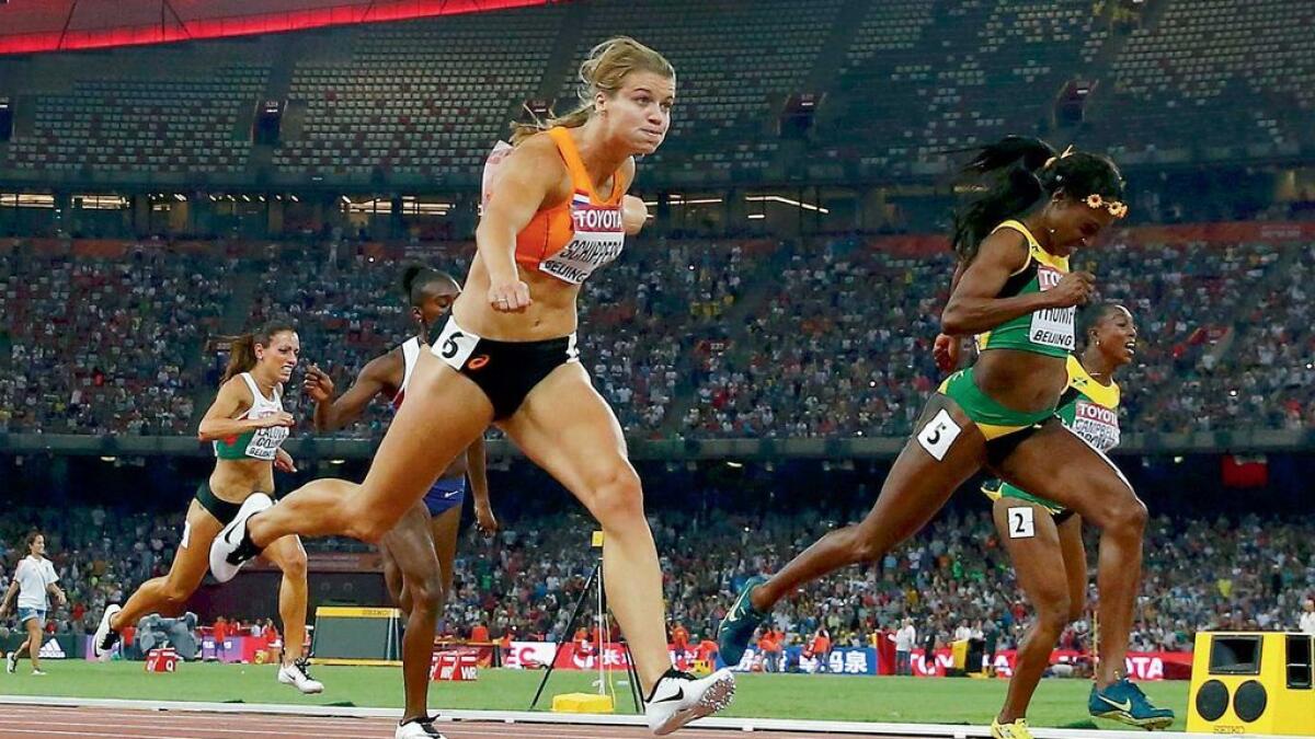 Dafne Schippers (6) on way to winning the women’s 200m final ahead of Elaine Thompson of Jamaica (right) during the 15th IAAF World Championships in Beijing. 