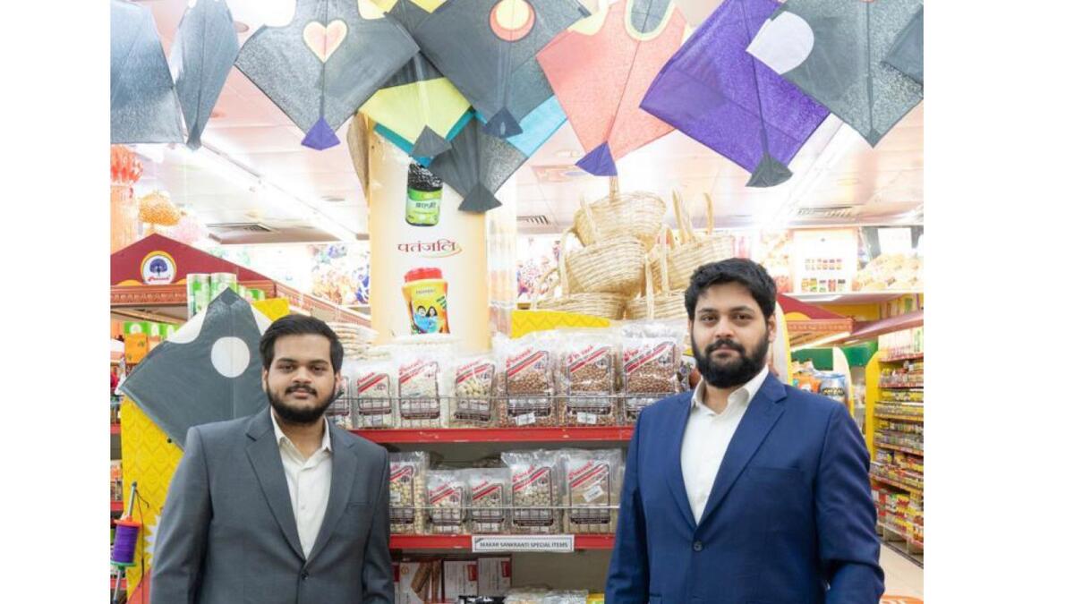 Hrishikesh and Rohit Datar, directors at Al Adil Trading with the Makar Sankranti products display.