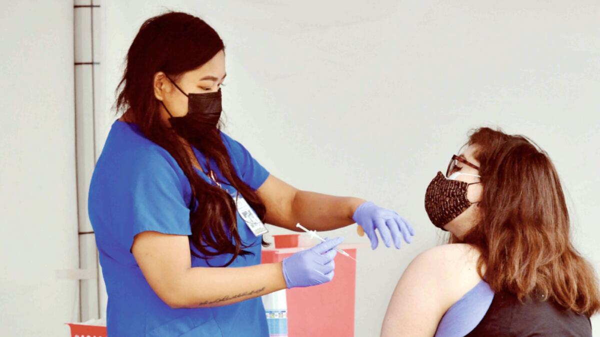 A health worker injects Covid-19 vaccine in Los Angeles. — AFP
