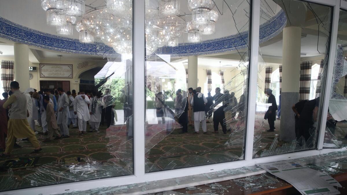 Afghans inspect the inside of a mosque following a bombing, in Kabul, Afghanistan on Friday, June 12, 2020. Photo: AP