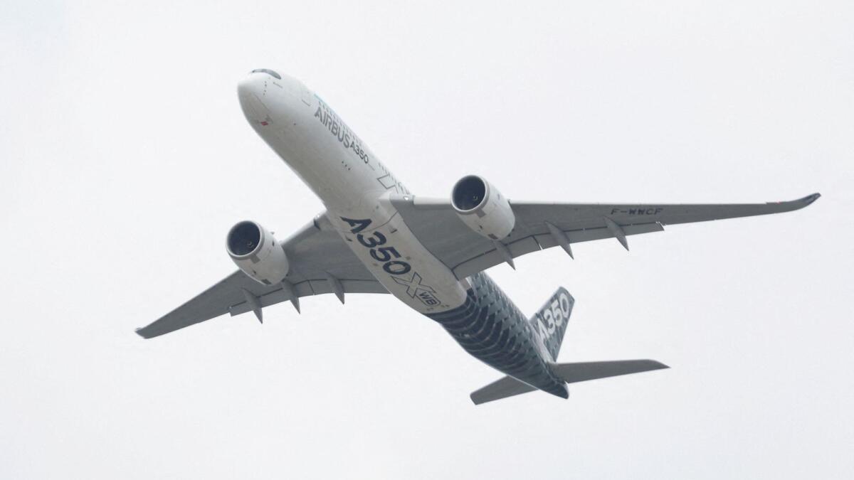 An Airbus A350 aircraft during a display at the Farnborough International Airshow last year. The planemaker aims to increase production of its new long-haul A350 by a third to nine per month. - Reuters file
