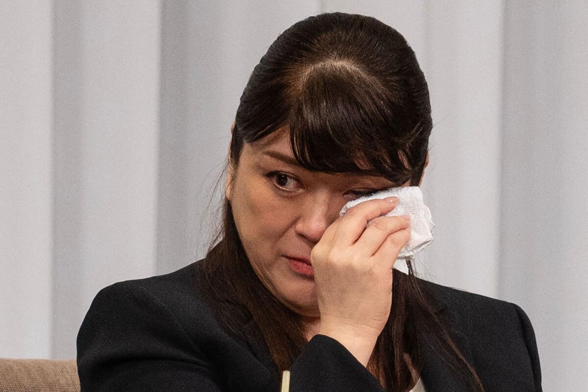 Outgoing president of Johnny and Associates Julie Keiko Fujishima wipes tears as she speaks to the media during a press conference at a hotel in Tokyo on September 7, 2023. — AFP