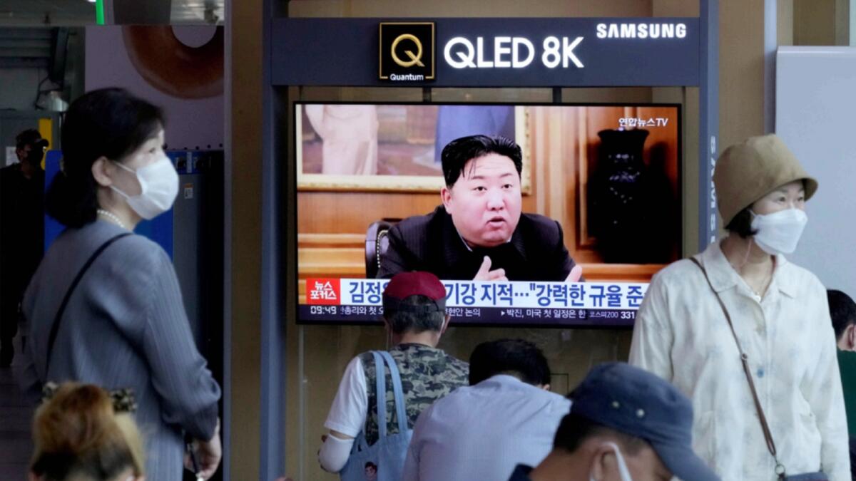 People watch a TV showing an image of North Korea leader Kim Jong Un during a news program at the Seoul Railway Station. — AP