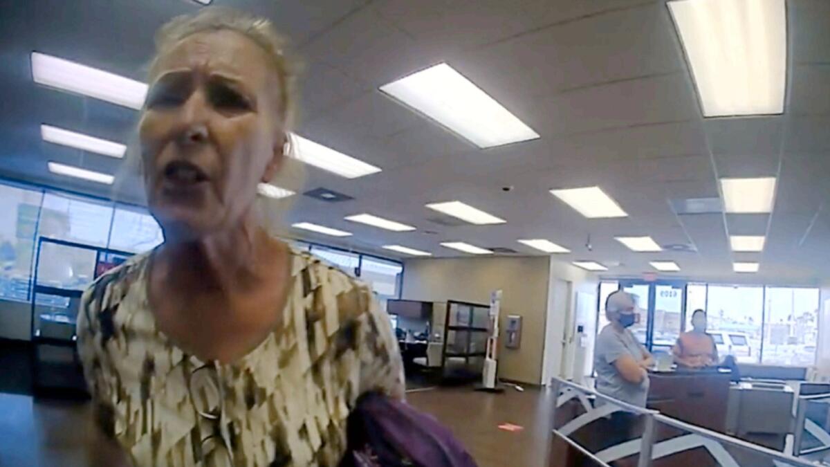 This frame grab from police body cam video shows Terry Wright, 65, of Grants Pass, Oregon, arguing with an officer inside a Bank of America branch. Photo:  Galveston Police Department via AP