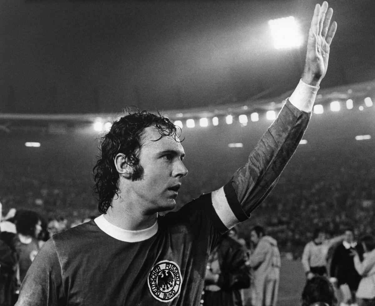 Franz Beckenbauer waves to the spectators after winning the 1974 World Cup 1974 match against Sweden. — AFP file