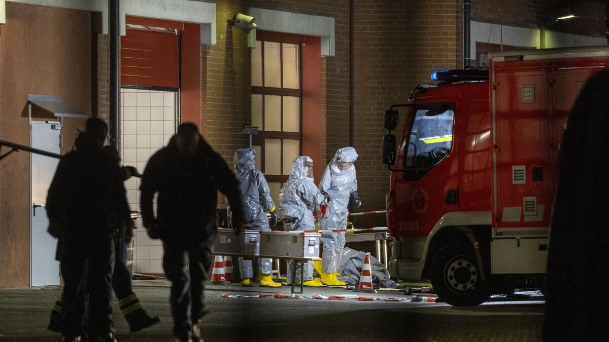 Substances found during the search are examined on the premises of the fire department in Castrop-Rauxel, Germany. — AP