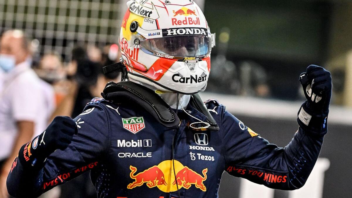Red Bull's Dutch driver Max Verstappen celebrates in the Parc Ferme of the Yas Marina Circuit after he took the pole position during the qualifying session of the Formula One Etihad Airways Abu Dhabi Grand Prix on Saturday.  — AFP