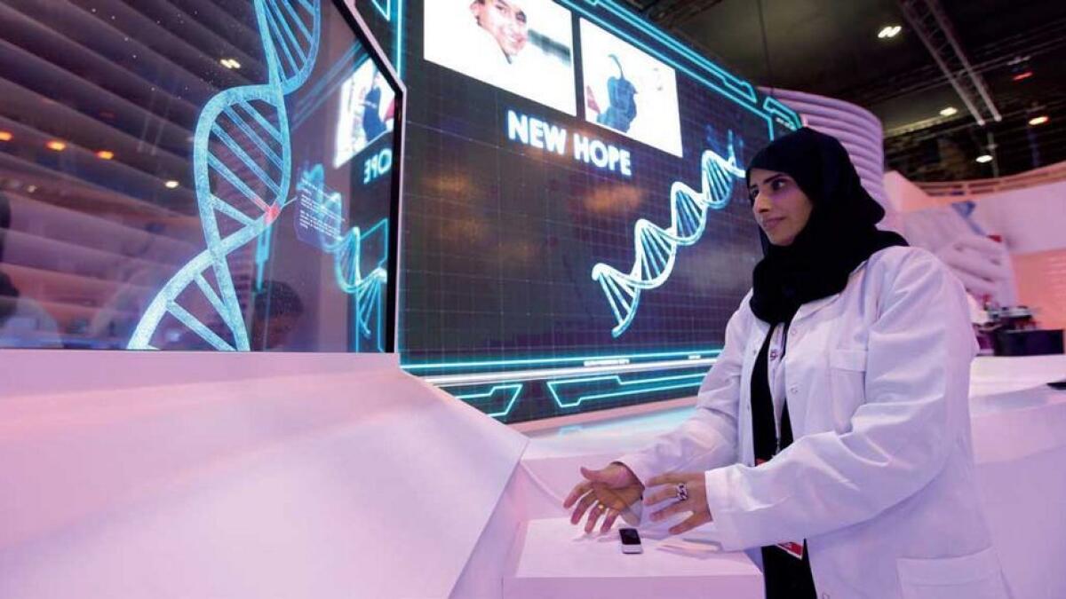 Dr. Noor Al Muhairi demonstrating Emirati Genome for personalised medicine at DHA stand.  