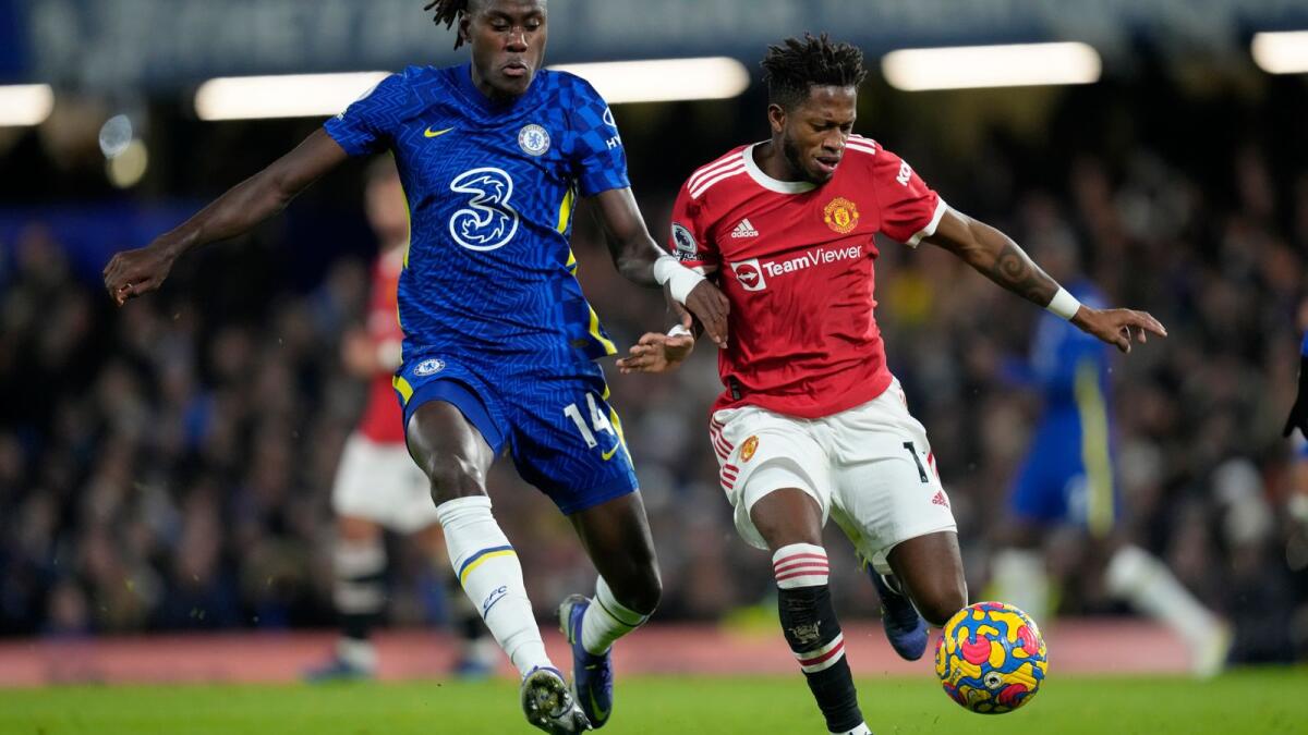 Chelsea's Trevoh Chalobah vies for the ball with Manchester United's Fred. (AP)