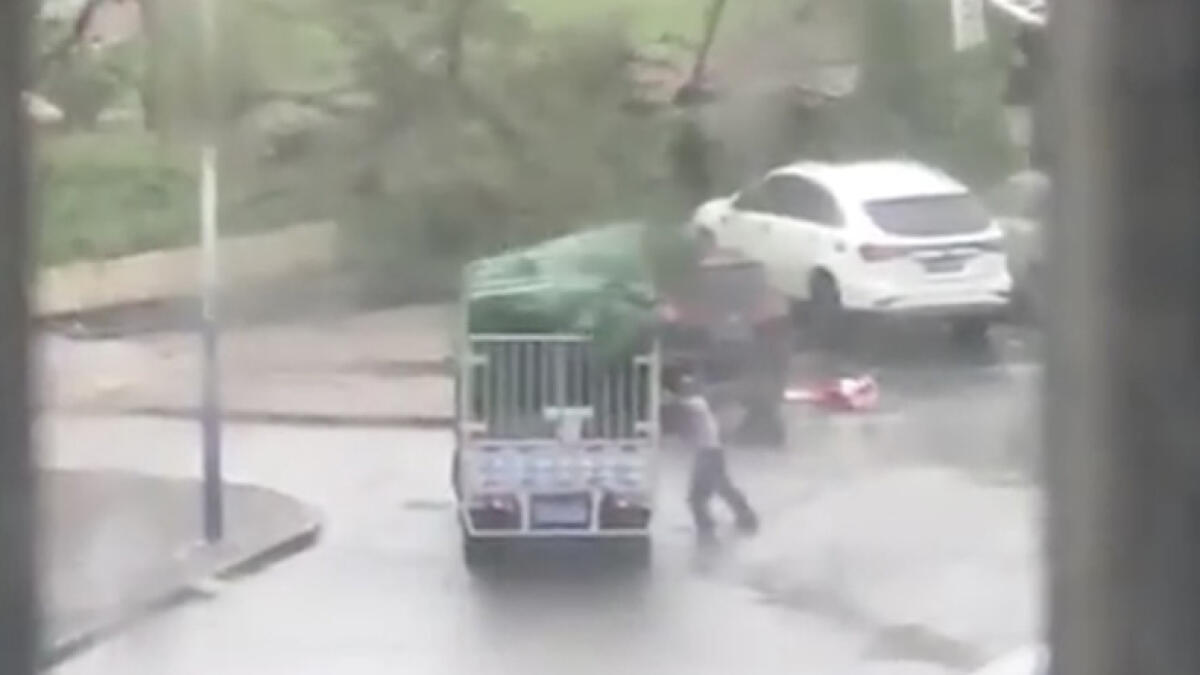 Video: Truck crushes man during Chinese typhoon
