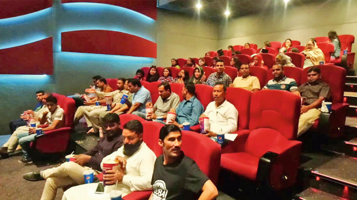 300 workers treated to a movie after completing English course