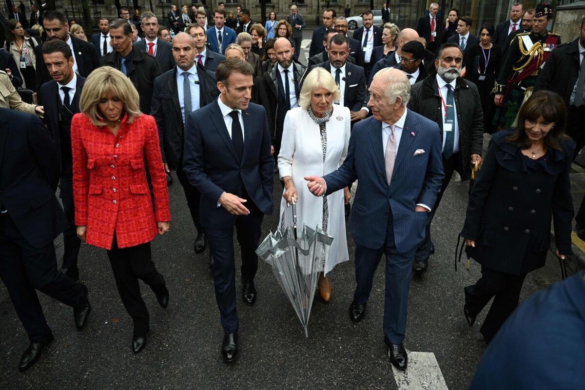 French President's wife Brigitte Macron, French President Emmanuel Macron, Britain's Queen Camilla, Britain's King Charles III and Paris' mayor Anne Hidalgo walk to visit to the Notre-Dame de Paris Cathedral, currently under restoration following a 2019 fire that destroyed its roof in Paris on Thursday. — AFP