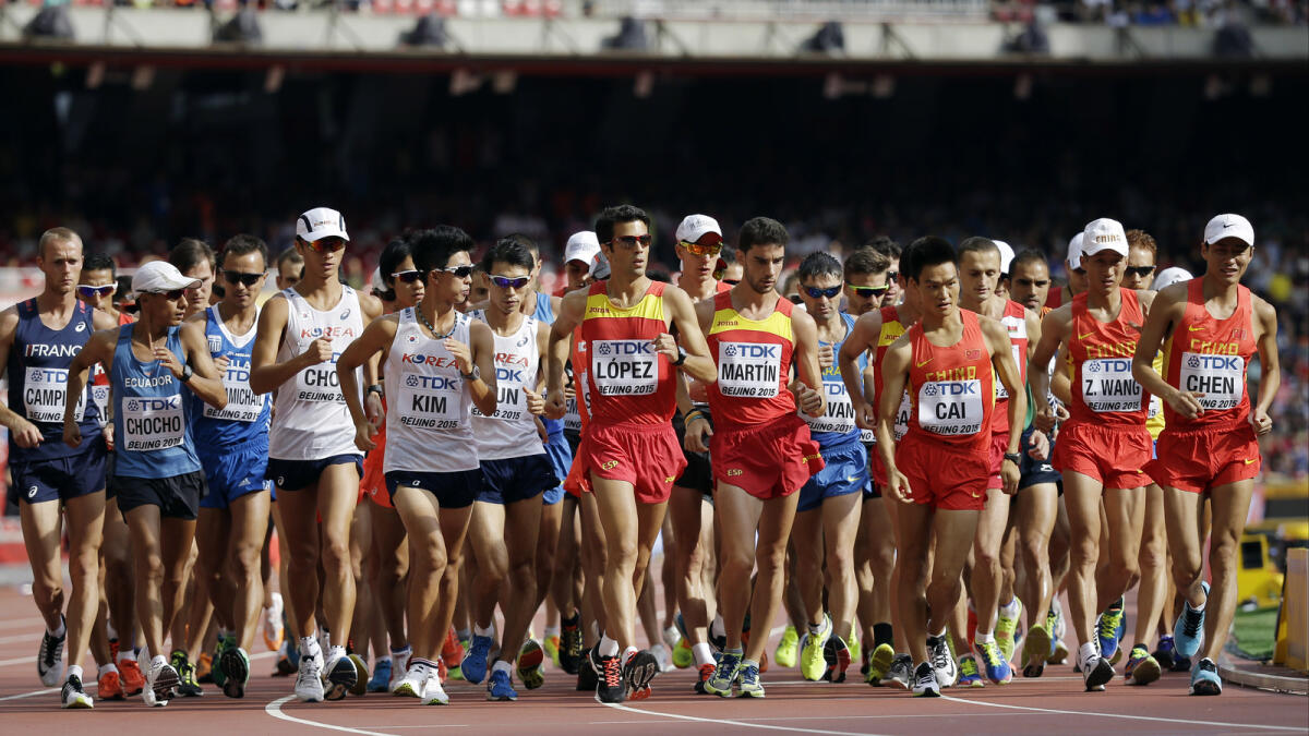 Competitors start the men?s 20k race walk final at the World Athletics Championships at the Bird's Nest stadium in Beijing on Aug. 23, 2015. 