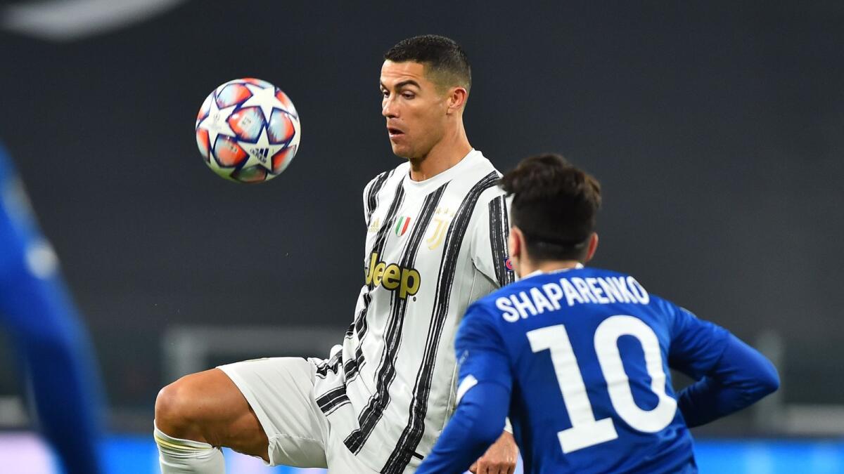 Juventus' Cristiano Ronaldo vies for the ball with Dynamo Kiev's Mykola Shaparenko during the match. (Reuters)