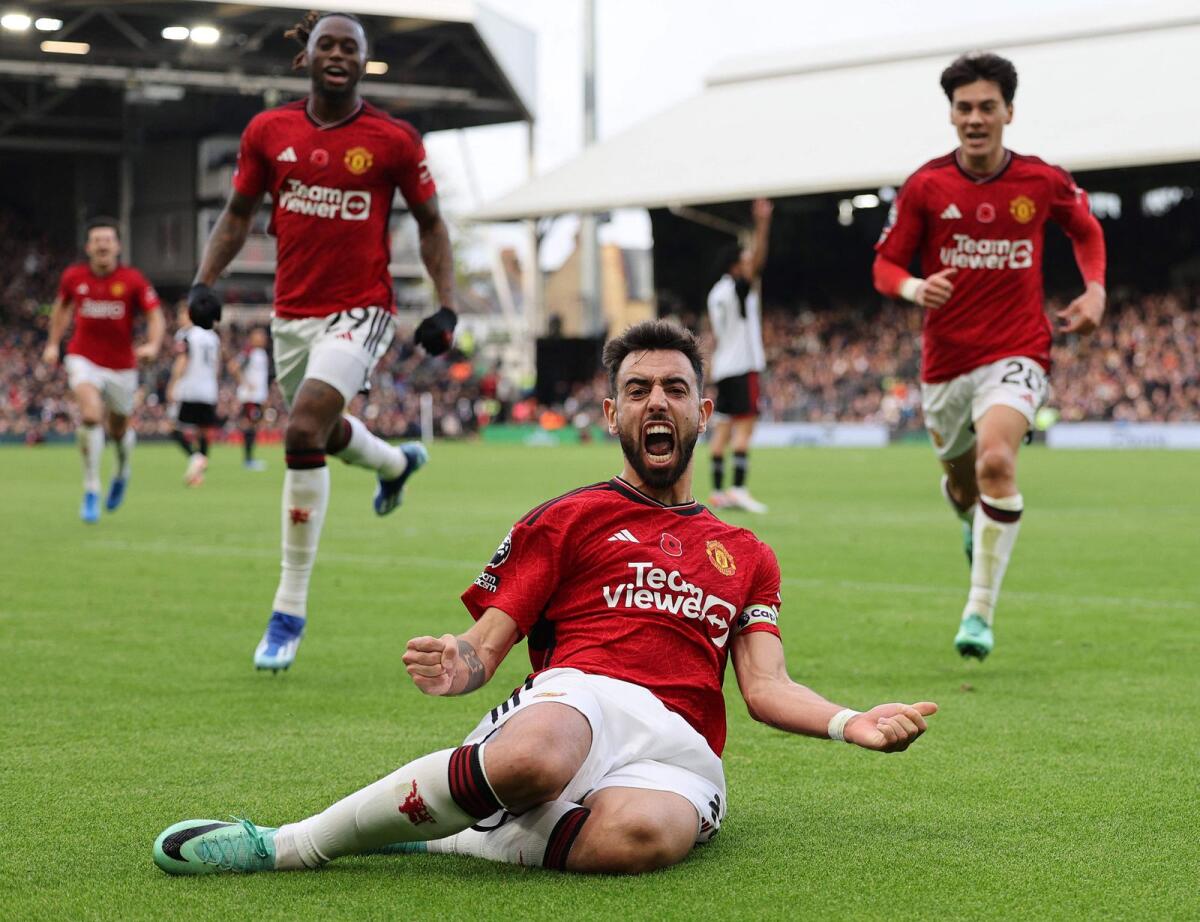Manchester United's Portuguese midfielder Bruno Fernandes celebrates scoring the winning goal during the English Premier League against Fulham at Craven Cottage in London on Saturday. - AFP