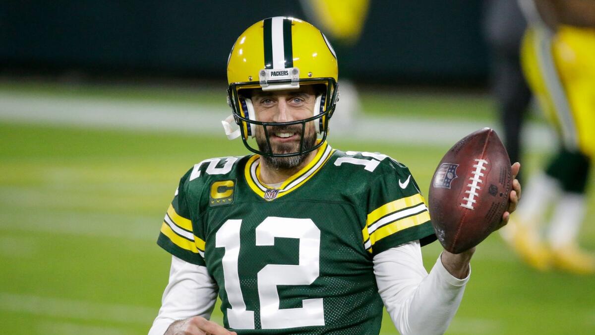 FILE - Green Bay Packers' Aaron Rodgers warms up before an NFL football game against the Chicago Bears in Green Bay, Wis., in this Sunday, Nov. 29, 2020, file photo. Rodgers is one of 32 players nominated for the seventh annual Art Rooney Sportsmanship Award, the NFL announced Thursday, Dec. 3, 2020. (AP Photo/Mike Roemer, File)